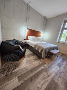 Postel nebo postele na pokoji v ubytování Hotel Amfiteatar