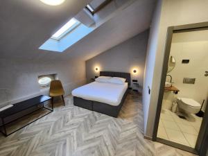 Postel nebo postele na pokoji v ubytování Hotel Amfiteatar