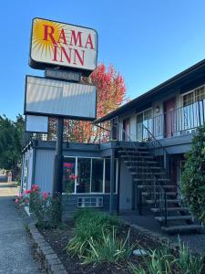 a roma inn sign and stairs in front of a building at Rama Inn in Washougal