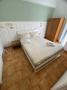 a small bedroom with a bed in a room at Loft Marinella l'aereoporto di Lamezia sul mare Kitesurf in SantʼEufemia Lamezia +52 photos