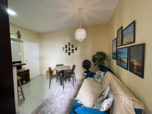 a living room with a couch and a table at Apartamento BEIRA MAR in Fortaleza