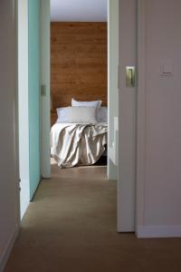 an open doorway to a bedroom with a bed at Can Jaume Private Villas by Ocean Drive in Ibiza Town