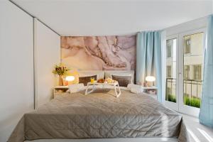 a bedroom with a large bed and a large window at Boutique Design-Suite-Apartment at best central Location in Zurich