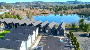 an aerial view of a row of houses next to a lake at The Commons - Urban Coastal Lodging in Seaside