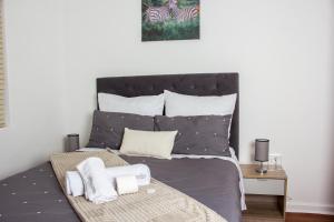 Katil atau katil-katil dalam bilik di Botha Villa Lodge Goodwood