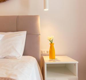 A bed or beds in a room at windmills suite by opus