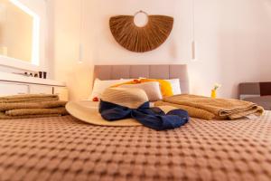 A bed or beds in a room at windmills suite by opus