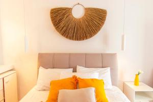 A bed or beds in a room at windmills suite by opus