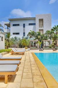 an image of a villa with a swimming pool at SENSES Boutique Hotel & Apartments in Kralendijk