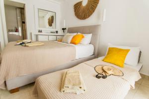 A bed or beds in a room at windmills suite by opus