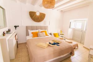 A bed or beds in a room at windmills suite by opus