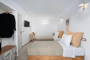 Postel nebo postele na pokoji v ubytování Electra Suites & Spa