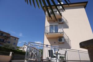 a building with two balconies on the side of it at Bellamar Apartments Kastav - Opatija in Kastav