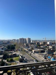 a view of a city with cars parked in a parking lot at Comfort,excellence. in Kamëz