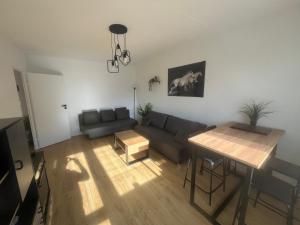 a living room with a couch and a table at Apartament Nati in Cieszyn