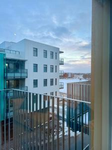 a balcony with a view of a building at Modern luxury apt downtown in Reykjavík