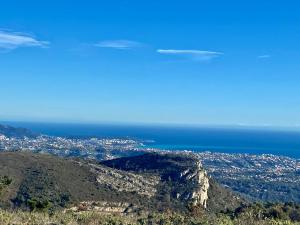an aerial view of a city and the ocean at La Casetta in Gattières +2 photos