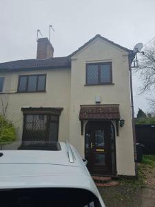 a white van parked in front of a house at Quiet family home in Tettenhall