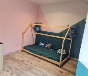 a room with a bunk bed in a room at Chambres proches du circuit des 24 heures du Mans, au calme in Fay