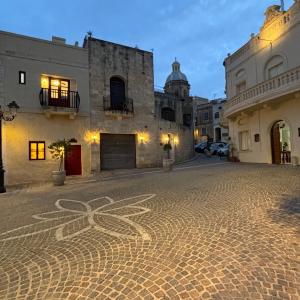 a street with a cross painted on the ground at Townhouse 7 in Dingli