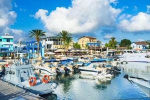 a bunch of boats docked in a marina at Blue pearl, seaside aprtm with pool at Latchi Marina in Polis Chrysochous