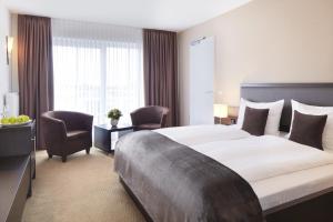 Voodi või voodid majutusasutuse nordica Hotel Friesenhof toas