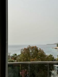 a view of the ocean from a window at Summer Gate Hotel in Ksamil