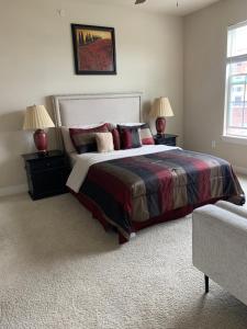 a bedroom with a large bed with two night stands at Your 1Br and LR Home Away From Home in Dallas