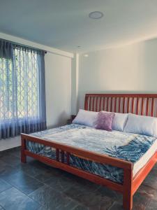 Llit o llits en una habitació de Finca Hotel La Aurora en Quindío