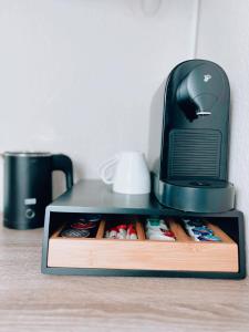 a black computer monitor sitting on top of a shelf at Dions Rooms in Norderney