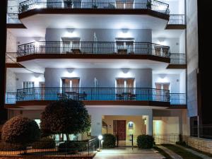 a building with balconies on the side of it at 4keys House Superior in Tripolis