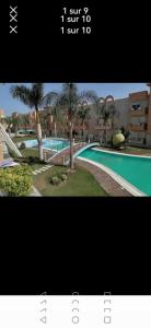 a picture of a swimming pool in a building at Résidence dunes du golf kantaoui in Sousse