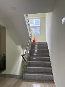 a staircase in a building with a stair case at Summer Gate Hotel in Ksamil