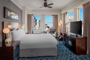 a hotel room with a bed and a television at Hotel Adagio, Autograph Collection in San Francisco