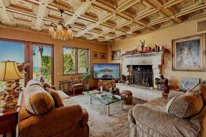 a living room with two couches and a fireplace at Malibu by the Sea - 5-STARS! in Solromar