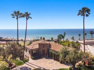 an aerial view of a house with palm trees and the ocean at Malibu by the Sea - 5-STARS! in Solromar