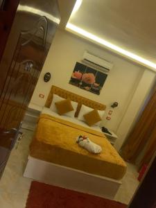 a bedroom with a large bed in a room at Salvatore Room With Simple Breakfast- Al Dokki in Cairo +21 photos