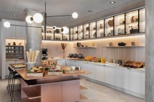 a kitchen with a counter with food on it at Residence Inn by Marriott Copenhagen Nordhavn in Copenhagen