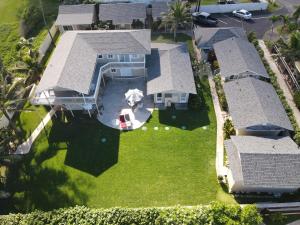 an aerial view of a house with a yard at Waimanalo Beach Cottages in Waimanalo