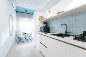 a kitchen with a sink and a counter top at B&B Porta del Salento in Brindisi