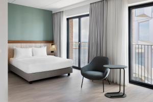 Postel nebo postele na pokoji v ubytování Fairfield by Marriott Copenhagen Nordhavn + 32 fotografií
