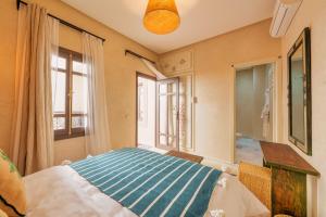 Postel nebo postele na pokoji v ubytování Riad Dar Arwa