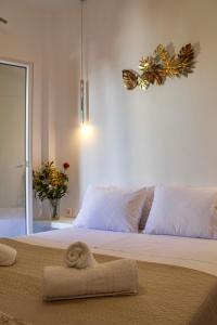 מיטה או מיטות בחדר ב-Aegean Pearl Studio