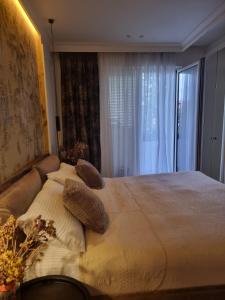 Postel nebo postele na pokoji v ubytování Ema Apartment Tirana