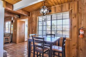 a dining room with a table and chairs at The Raccoon Retreat + Firepit + Spa + BBQ in Sugarloaf