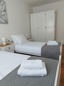 Łóżko lub łóżka w pokoju w obiekcie Antemma Apartment