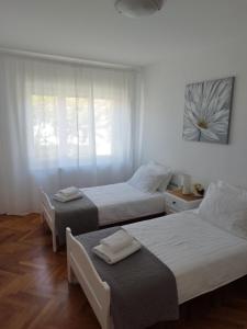 Łóżko lub łóżka w pokoju w obiekcie Antemma Apartment