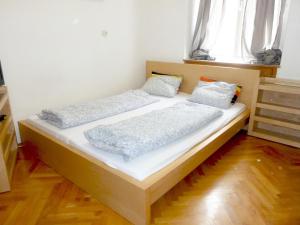 Postel nebo postele na pokoji v ubytování Apartment Jakominiplatz