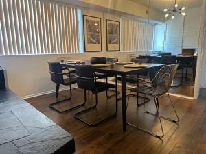 a dining room with a table and chairs at Exclusive Beverly Hills Apartment Awaits - Book now! in Los Angeles