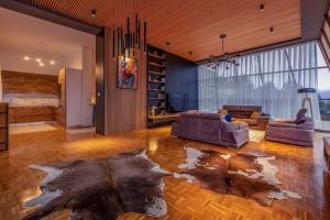 a living room with two couches and a rug at Luxurious Villa in Prevalla in Prevallë